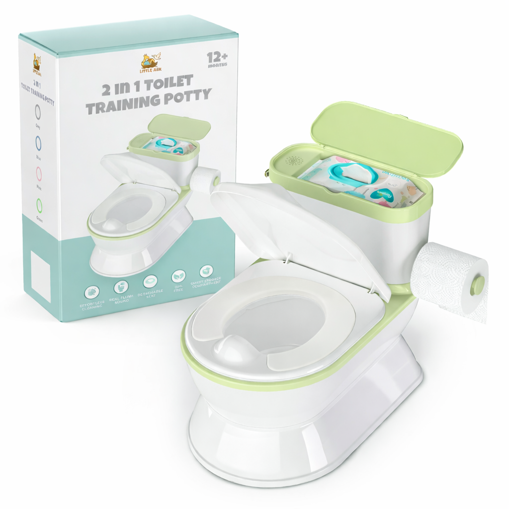 A 2-in-1 toilet training potty shown with its packaging box. The potty is white with light green trim, featuring an open lid, a built-in storage bin filled with training pads, and a roll of toilet paper on the side.